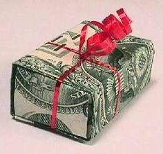 money wrapped in red ribbon on white background