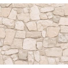 a stone wall that looks like it has been made out of rocks and is beige