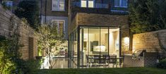 an outdoor patio and dining area at night