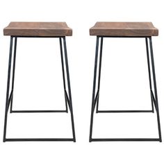 two wooden stools sitting next to each other