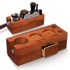 two wooden containers with compartments and spoons in them