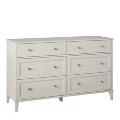 a white dresser with six drawers and gold handles