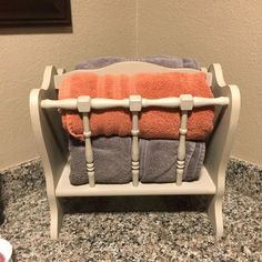 a towel rack with two towels on it