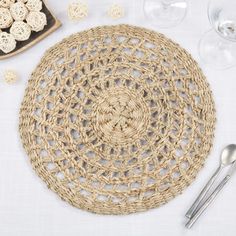 a place setting with crochet doily and silverware