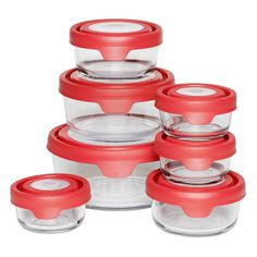 set of six glass storage containers with red lids and lids on each side, stacked up