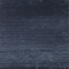 an area rug with dark blue colors