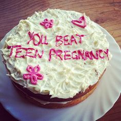 a cake with frosting and writing on it