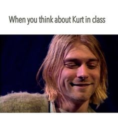 a man with long hair smiling and wearing a sweater over his shoulders that says, when you think about kurt in class