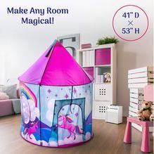 a kid's play tent in the middle of a room with pink furniture and accessories