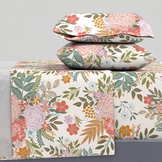 three floral sheets stacked on top of each other