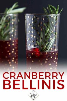 two glasses filled with cranberry bellins and rosemary sprigs in them