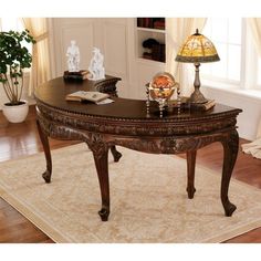 a living room with a couch, table and lamp on top of the carpeted floor