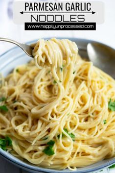 a spoon full of creamy garlic parmesan noodles