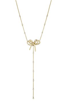 A layered bow ties up this 18-karat-gold Y-necklace glittering with pavé and bezel-set diamonds. Total diamond weight: 0.29ct. Color: G-H Clarity: VS 18k gold/diamond Made in Brazil >Diamond Guide Latinx Owned and Founded Elegant Gold Necklace With Bow Detail, Elegant Gold Necklace With Bow, Luxury Lariat Diamond Necklace Gift, Luxury Lariat Diamond Necklace As Gift, Luxury Lariat Diamond Necklace For Gift, Luxury Diamond Bow Jewelry, Elegant Gold Lariat Necklace With Diamond, Elegant Gold Diamond Lariat Necklace, Elegant Diamond Jewelry With Bow Detail