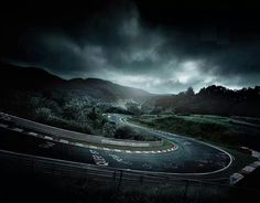 an image of a winding road in the dark