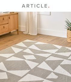 an area rug is shown with the words article written in white and grey on it