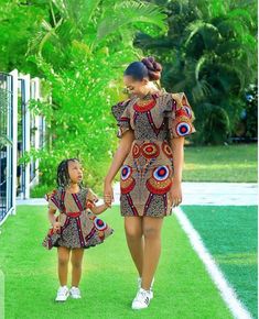 This is an African Print Mom and Daughter Matching Outfit for photo-shoot and other social event. Features: * Brand New 100% cotton fabric of highest grade/quality. * Carefully lined for perfect fit. * Professionally sewn and finished. Before ordering, kindly go through the available fabrics and size chart to make your choice. If you wish to provide your measurements for more perfect fit, kindly send the following: * Bust * Waist * Hip For your daughter, please send her size or measurement to me Ankara Inspiration, African Kids Clothes, African Traditional Wear, African Party Dresses, Mommy Daughter Outfits, African Print Dress Ankara, African Dresses For Kids, Short African Dresses, Afrikaanse Mode