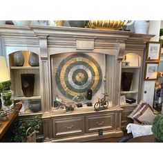 an antique display cabinet with decorative items on it