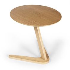 a small wooden table with a circular top and two legs on one side, in the shape of an x