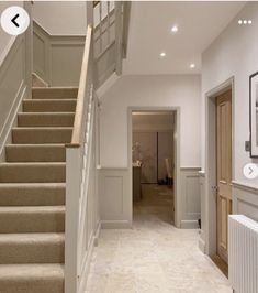 the stairs in this house are white and beige