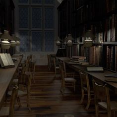 an empty library with many books on the shelves and desks in front of them