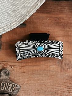 Western Silver and Turquoise Concho Claw Clip | Gussied Up Online Boutique Add a touch of Western style to your hair with our silver concho claw clip! The 3" black clip features a stunning turquoise stone concho, making it both functional and fashionable. Stand out with this unique accessory! Western Antique Silver Jewelry With Concho, Western Hair Clips, Western Claw Clips, Western Hair Barrettes, Turquoise Hair Clip, Black Claws, Western Boutique, Western Wear For Women, Wedge Heel Sandals