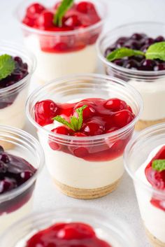 two desserts with cherries and mint garnish on a plate