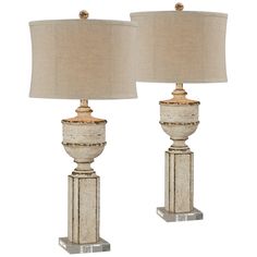 two white lamps sitting next to each other