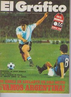 a magazine with an image of two soccer players on the cover and one is kicking a ball