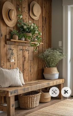 a wooden bench sitting in front of a wall filled with plants and baskets on top of it