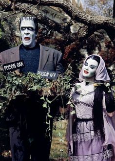 two people dressed in costumes standing next to each other with signs on their heads that read posion and ivy