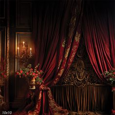 an ornately decorated bed with red curtains and flowers in vases next to it