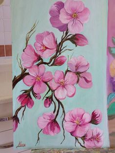 a painting of pink flowers on a blue background