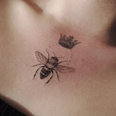 a bee with a crown tattoo on its chest