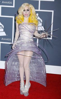 lady in plastic dress on red carpet at awards