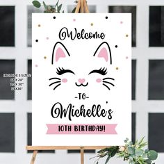 a sign that says welcome to someone's 10th birthday with a cat face on it