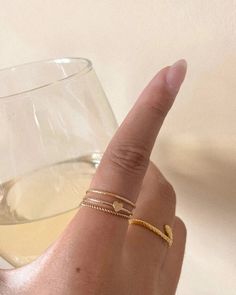 Featuring a dainty stacking ring with a twisted rope design. Made in 14k gold-fill, she's tarnish-resistant, showerproof, and safe for sensitive skin. Just keep her away from chemicals such as hand sanitizer, soap, and lotion. She looks beautiful stacked or as a solo ring. …………………………………. D E T A I L S • Available from US 5 to 9• Width measures 1mm• Keep away from chemicals such as lotion, soap, and hand sanitizer• Tarnish-resistant, waterproof, and safe for sensitive skin • 100% 14K Gold Filled Dainty Ring Stack, Teen Ring, Multiple Rings, Ring Stack, Soft Toothbrush, Gold Ring Stack, Rope Design, Jewelry Lookbook, Tiny Heart