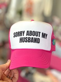 This light pink and white trucker hat is the perfect accessory for anyone with a good sense of humor. With the playful phrase "sorry about my husband" prominently displayed on the front, this hat is sure to bring a smile to anyone's face. -Snapback closure Novelty Pink Hat With Letter Print, Pink Novelty Hat With Letter Print, Funny White Adjustable Baseball Cap, Personalized Pink Snapback Trucker Hat, Funny White Hat For Gift, Funny White Hat As Gift, Funny White Hat As A Gift, Funny White Trucker Hat Baseball Cap, Funny White Baseball Cap Trucker Hat