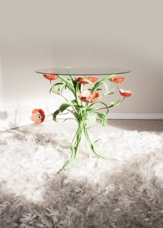 a glass table sitting on top of a fluffy white floor next to a window with flowers in it