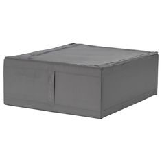 a large gray box sitting on top of a white surface with an open lid and zippered sides