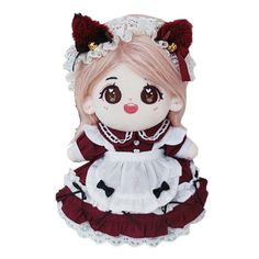 a stuffed doll wearing a red and white dress