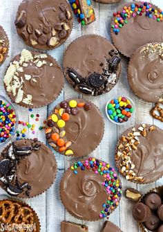 chocolate frosted cupcakes with sprinkles and pretzel toppings