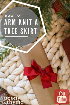 how to arm knit a tree skirt with ribbon and pom - poms for christmas