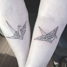 two people with matching tattoos on their legs, one has an origami bird