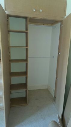 an empty closet is shown with shelves and drawers