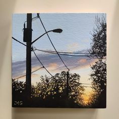 an acrylic painting of power lines and trees at sunset with the sky in the background