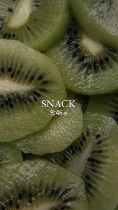 sliced kiwi fruit with the word snack on it's bottom right hand corner