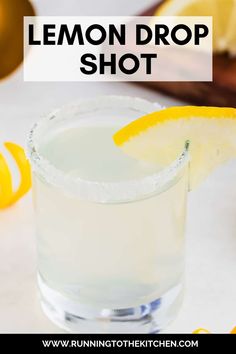 a lemon drop shot is garnished with an orange slice