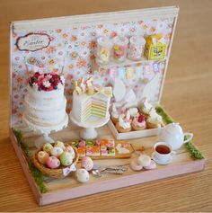 a miniature cake and dessert display on a table