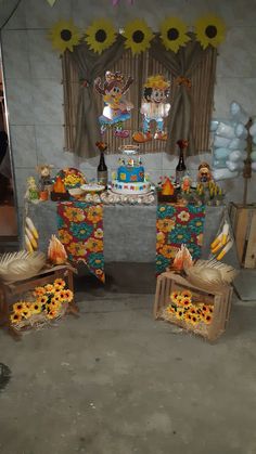 the table is decorated with sunflowers and decorations